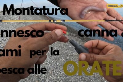 Manos montando un aparejo con plomo y anzuelo junto a una caña en una playa de guijarros